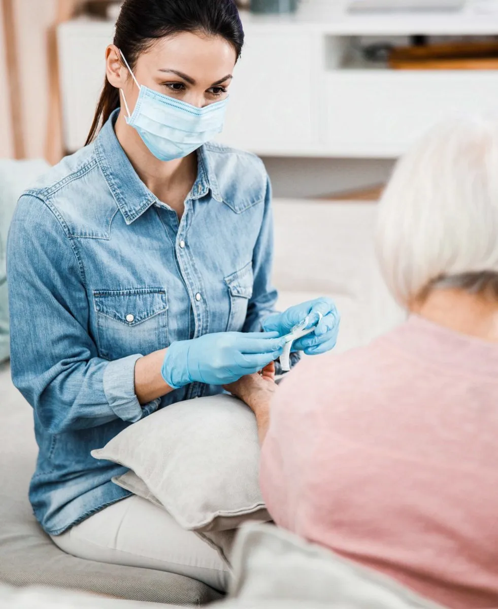 Senior woman with nurse